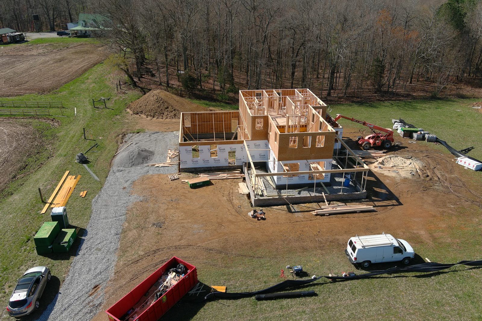 Framing crew and equipment on a new home build, seen from above